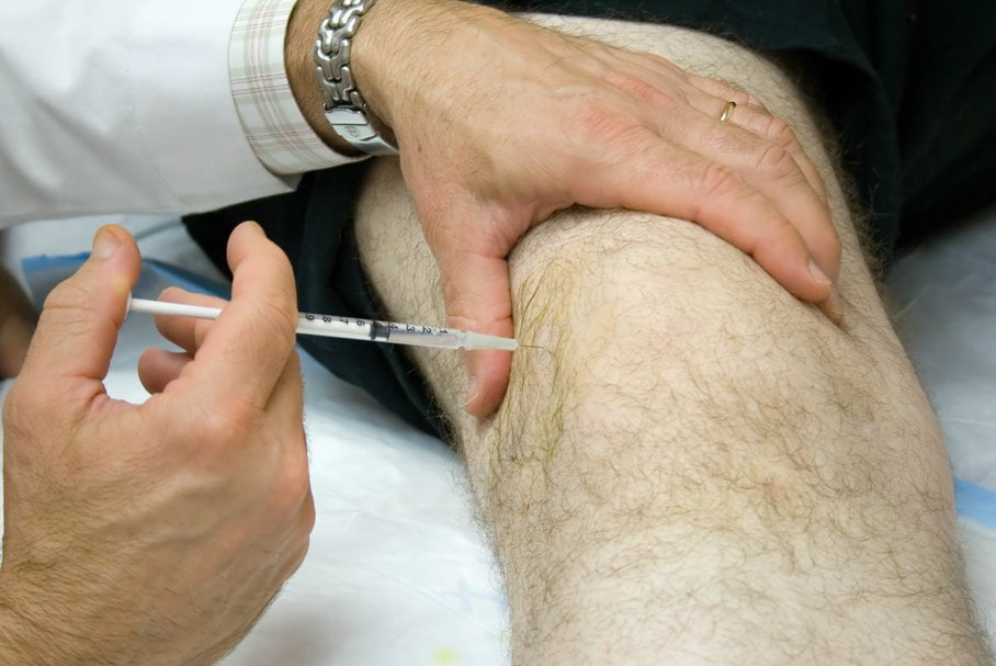 Patient receiving hyaluronic acid joint injection